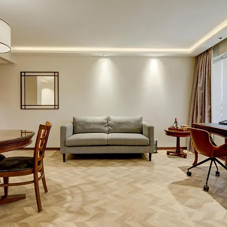 Plaza El Bosque Ebro Hotel Santiago Exterior photo A living room with a parquet floor